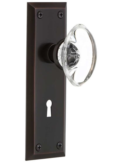 New York Style Door Set with Oval Crystal Glass Knobs in Timeless Bronze.